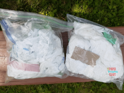 Ziploc bags with trash inside of them.