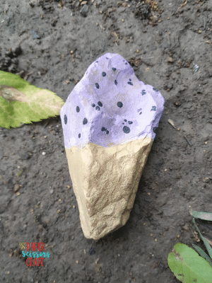 Painting rocks on a trail (2)