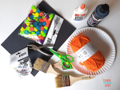 Paper plate spider web craft supplies.