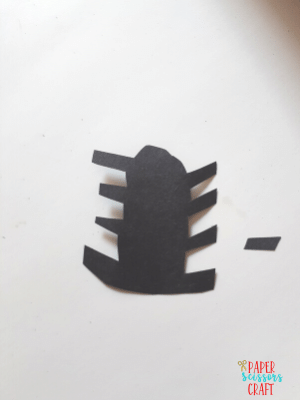 Black spider cut out from construction paper.