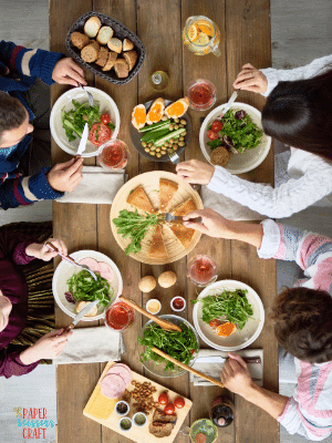 Birds eye view of family of four eating dinner.