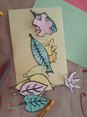 Leaves that have been colored in with crayon and cut out into leaf shapes.