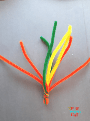 Four pipe cleaners twisted together on one end.